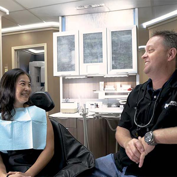 Dr. Anderson talking to patient about oral surgery